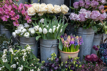 A variety of colors near the Liberty store in London. Large bouquets in tin vases.