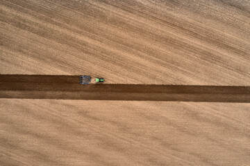 plowing farm after harvesting with vehicle