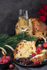 Traditional Italian Christmas fruitcake panettone with raisins and candied fruits. Holiday food for Christmas and New Yea