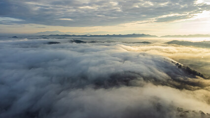 Fototapeta na wymiar Aerial view of landscape Sunrise above clouds dramatic light
