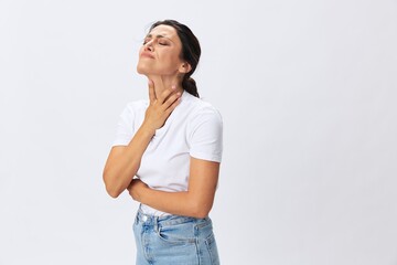 Woman pain throat and back, colds, cold and flu disease, covid-19, in a white t-shirt on a white background