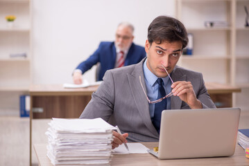 Two male colleagues sitting in the office