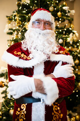 Photo of happy Santa Claus in eyeglasses looking at camera
