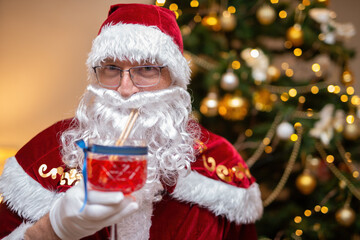 Santa Claus drinking a cocktail