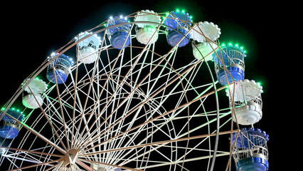 Spinning ferris wheel in motion