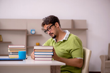 Young male student studying at home