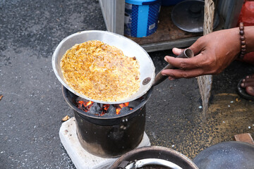 Kerak Telor, traditional food from Jakarta, Indonesia. Made from white sticky rice, eggs, dry roasted dried shrimp, fried shallots, roasted coconut