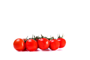 Branch of fresh cherry tomatoes with green stems isolated on white background. Clipping path.