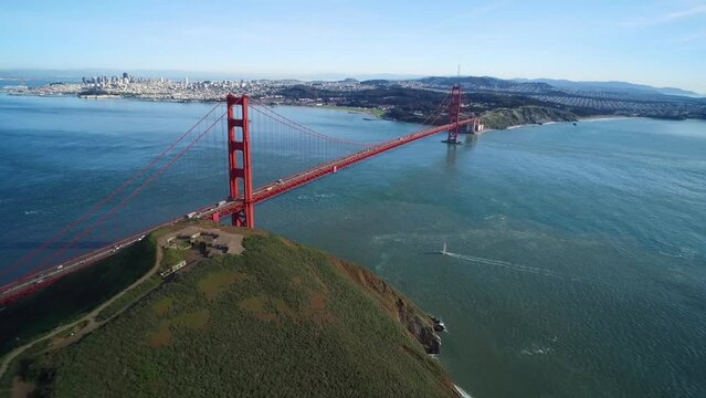 Aerial view pushing towards the Golden Gate Bridge on a gloomy overcast day.