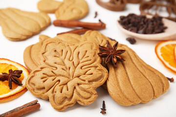 Tasty cookies and spices on white table, closeup