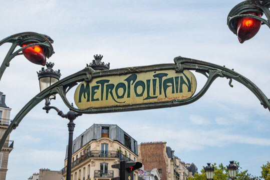 Paris, France. August 2022. Close up of a Metropolitain sign, indicating the entrance to a subway station. The parisian metro system is famous for its unique style, which is mainly Art Nouveau.