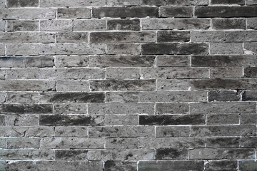 facade view of old gray brick wall background