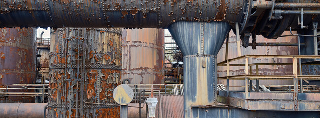 Panoramic rusting Tanks and pipes running for miles inside the closed and abandoned Bethlehem Steel...