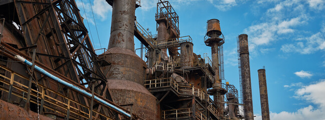 Panoramic rusting Tanks and pipes running for miles inside the closed and abandoned Bethlehem Steel works in Bethlehem Pennsylvania