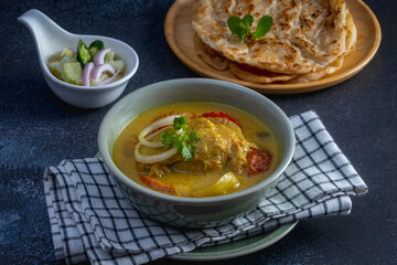 yellow curry chicken with homemade roti