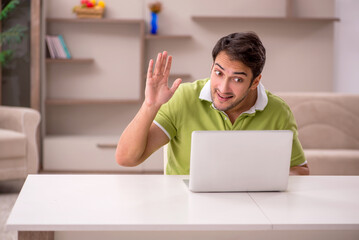 Young man working from home during pandemic