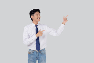 Portrait young asian business man pointing and presenting isolated on white background, advertising and marketing, executive and manager, male confident showing success, expression and emotion.