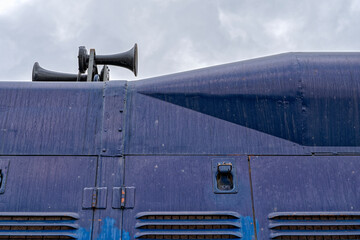 The air horns on the roof of a locomotive