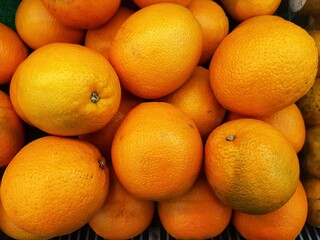 pile of fresh Lemons. Yellow lemons are sold in traditional markets.