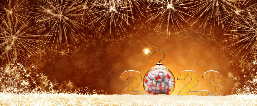 New Year card with ice number 2023 on snow. Christmas tree toy in a ball with gifts in the form of a bomb. Festive banner with fireworks on the background of night abstract defocused lights.