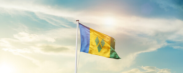 Waving Flag of Saint Vincent and the Grenadines with beautiful Sky.