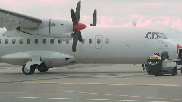Pilot in ATR 72 Aircraft At The Airfield With Engine Off - Static