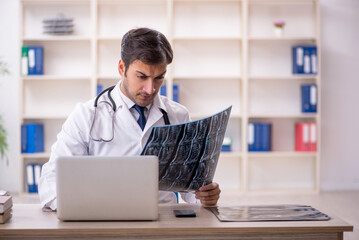 Young male doctor radiologist working in the clinic