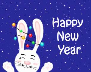 Fototapeta premium White bunny with garland on the background of the winter sky