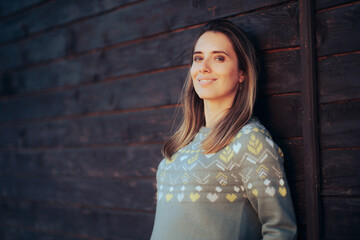 Naklejka premium Portrait of an Optimistic Woman Smiling Wearing Cool Sweater. Happy charismatic lady in knitwear fashion item 