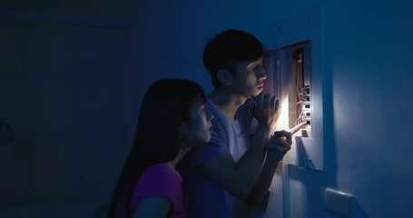 asian couple with power outage