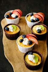 fresh cupcakes with fruits and berries