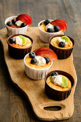 fresh cupcakes with fruits and berries