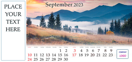 September 2023. Desktop monthly calendar template with place logo and contact information. Set of calendars with amazing landscapes. Foggy autumn sunrise in Carpathian mountains, Ukraine, Europe.