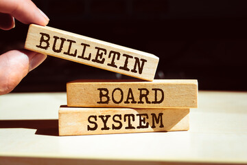 Wooden blocks with words 'Bulletin Board System'.