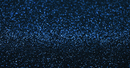 Bokeh light background. Blur glitter texture. Fantasy glare. Defocused blue color shiny sparkles glow reflection on dark black abstract free space poster.
