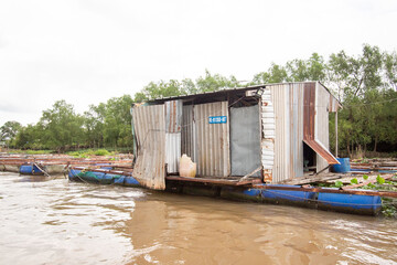 Fototapeta na wymiar Floating Fish Farm on the Mekong River