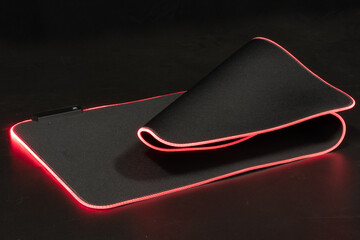 large flexible backlit mouse pad on a dark background - 551452069
