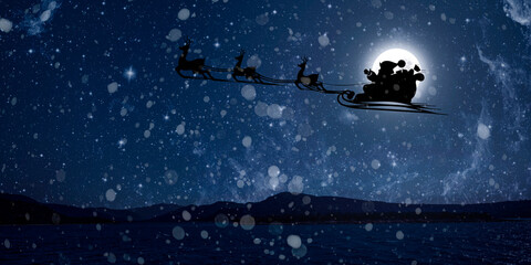 Naklejka premium Santa Claus flies on Christmas Eve in the night sky with snow