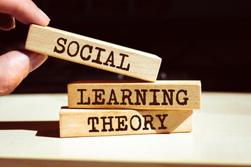 Wooden blocks with words 'Social learning theory'. - obrazy, fototapety, plakaty