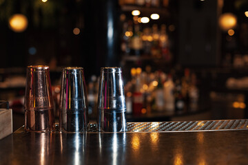 Lower the top of the wooden table with blurred racks and bottles Background/For mounting the product display or visual