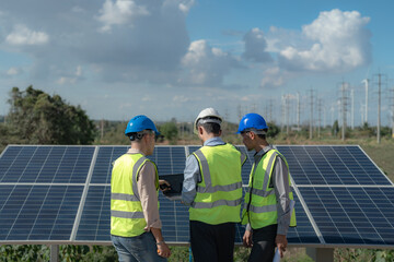 engineer man inspects construction of solar cell panel or photovoltaic cell by electronic device....