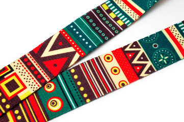 Neck strap in bright abstract neoprene for comfortable ukulele playing.