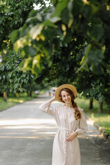 Obraz premium Young couple in love outdoor.Stunning sensual outdoor portrait of young stylish fashion couple posing in summer in field