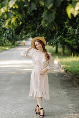 Obraz premium Young couple in love outdoor.Stunning sensual outdoor portrait of young stylish fashion couple posing in summer in field