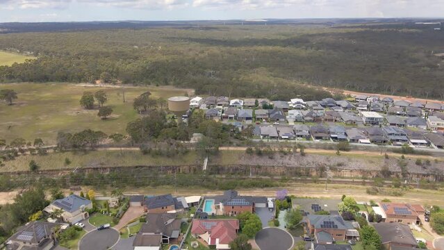 Aerial drone view of Voyager Point in South West Sydney, NSW Australia heading toward the train line and Heathcote Road  