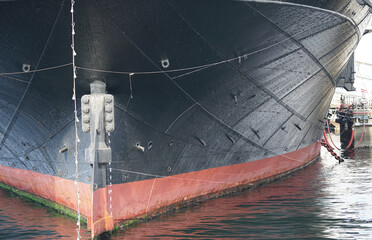 The stern of the ship anchoring in the port