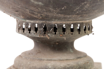 Ash pit of old dirty Russian samovar in a cobweb.