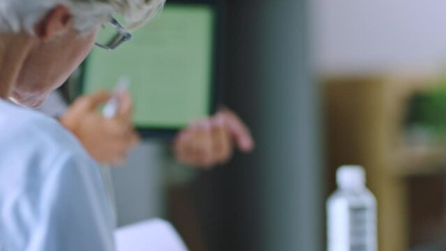 Business meeting, tablet and office presentation with a senior woman learning in ux design workshop. Elderly worker working and listening to programmer strategy idea ready for web designer walk