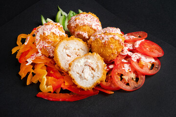 Rice balls stuffed with mozzarella cheese and salmon