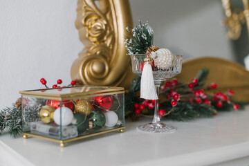 Christmas table decor, a box with balls and a glass